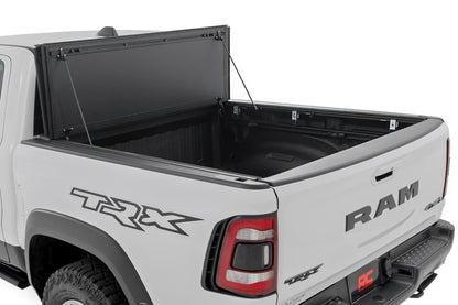 Hard Tri-Fold Flip Up Bed Cover 6 Foot 4 Inch Ram 1500 (19-26)/1500 TRX (21-24) Rough Country-1
