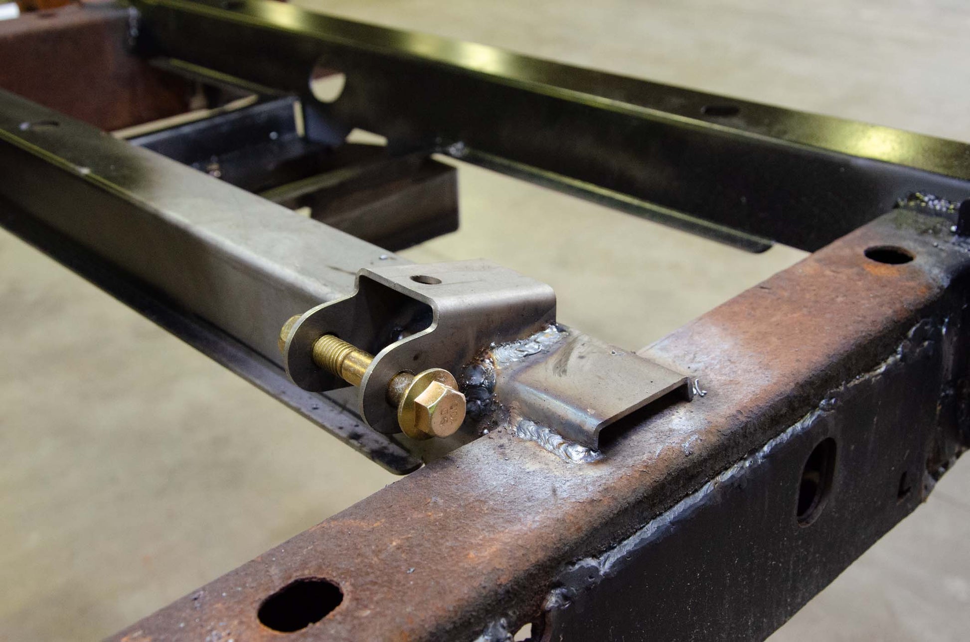 Rust Buster Frameworks Rust Buster Left Rear Shock Mount For 2002-2009 Dodge Ram 1500 RB7727