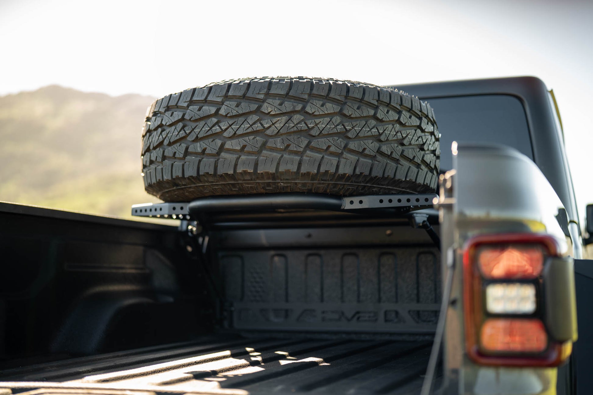 2020 2025 Jeep Gladiator JT Adjustable In Bed Tire Carrier DV8 Offroad-13