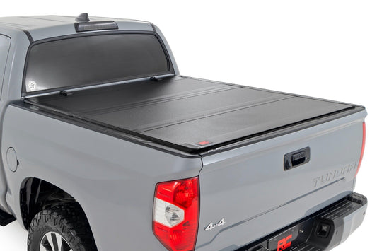 Hard Tri-Fold Flip Up Bed Cover | 5'7" Bed | Toyota Tundra 2WD/4WD (07-21) Rough Country