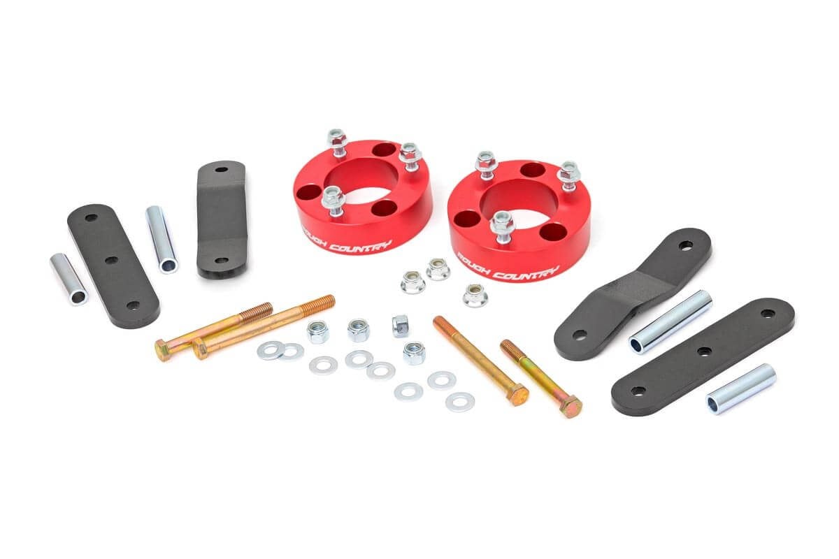 2.5 Inch Leveling Kit | Red Spacers | Nissan Frontier (05-24)/Xterra (05-15)  Rough Country