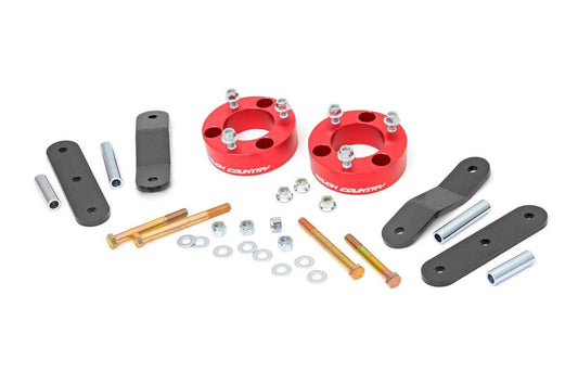 2.5 Inch Leveling Kit | Red Spacers | Nissan Frontier (05-24)/Xterra (05-15)  Rough Country